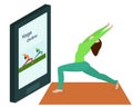 A young woman does yoga online at home.